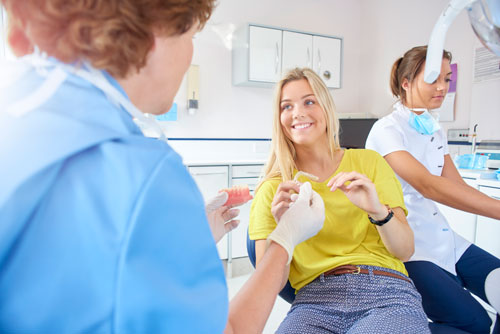 Patient discussing post-operative instructions at Grins & Giggles Family Dentistry in Spokane Valley, WA