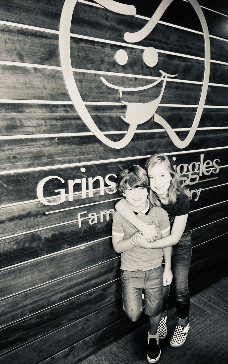 Children smiling together about their fun visit to Grins and Giggles Family Dentistry in Spokane Valley, WA Children smiling together about their fun visit to Grins and Giggles Family Dentistry in Spokane Valley, WA