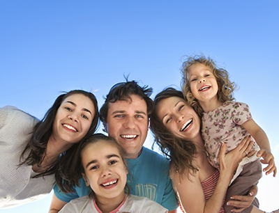 Spokane Valley, WA family smiling about their visit to Grins & Giggles Family Dentistry