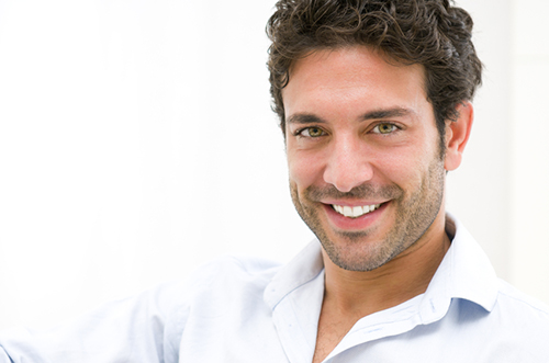 Spokane Valley, WA man smiling about his cosmetic dental bonding at Grins and Giggles Family Dentistry.