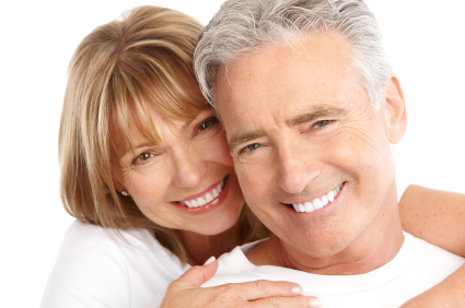 Couple smiling after getting new dentures at Grins & Giggles Family Dentistry in Spokane Valley, WA